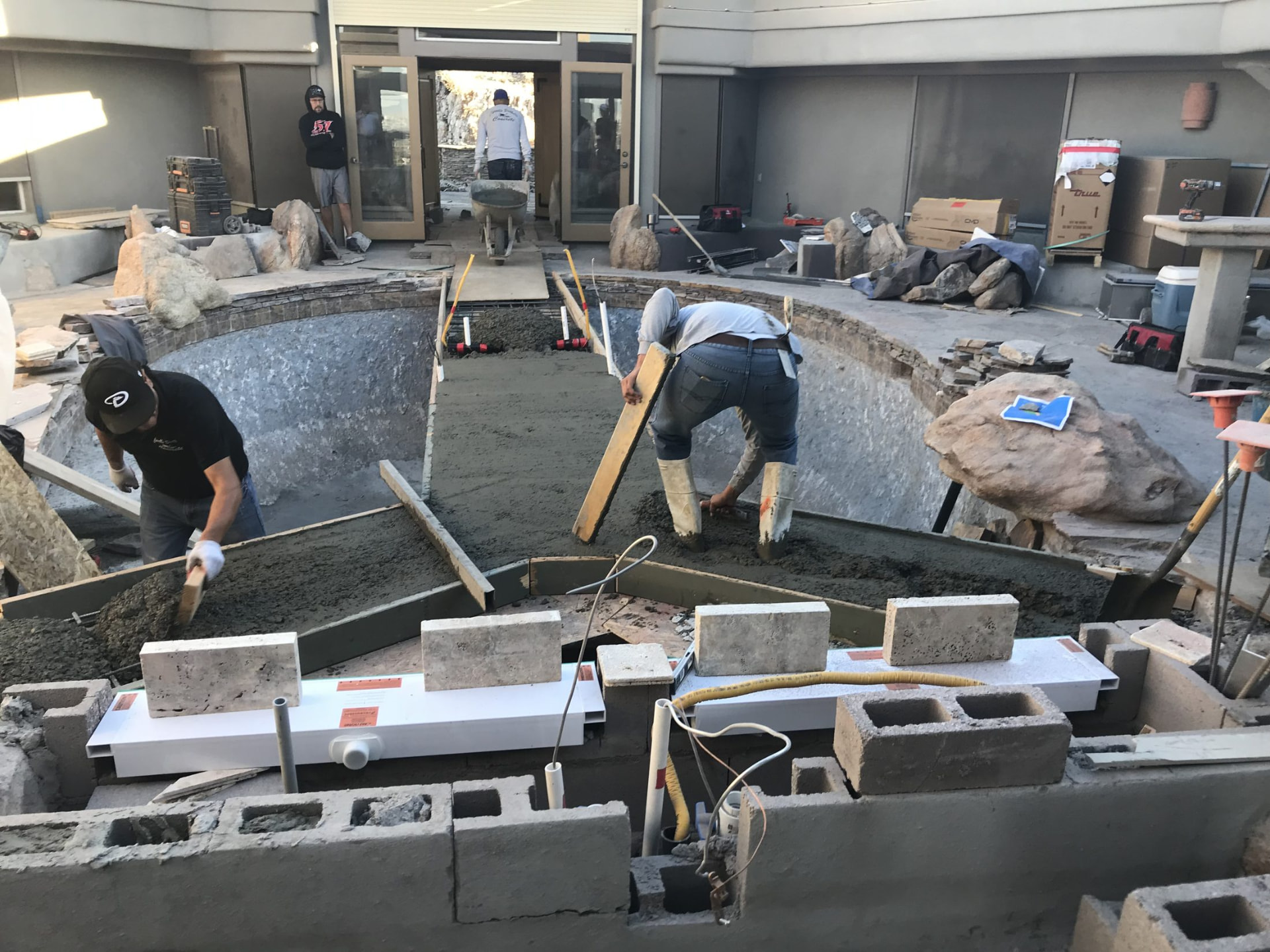 Construction materials staged in the backyard as work gets underway