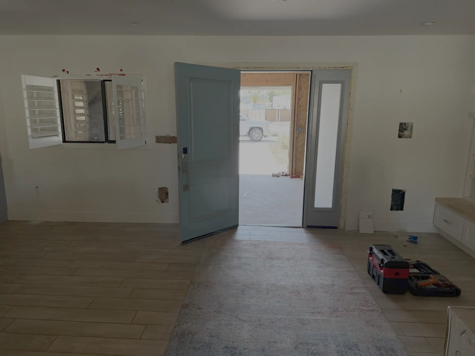 Front entry construction underway with framing visible through the open doorway