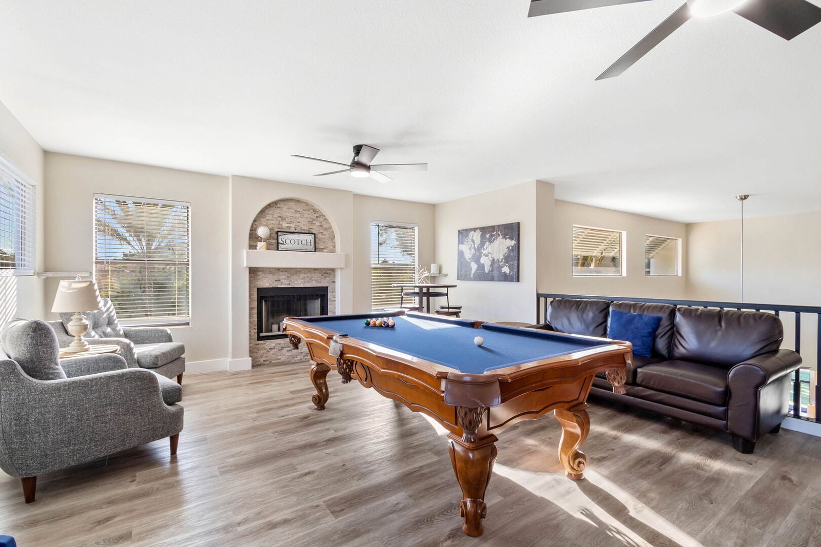 Upstairs loft converted into a game room with pool table and lounge seating
